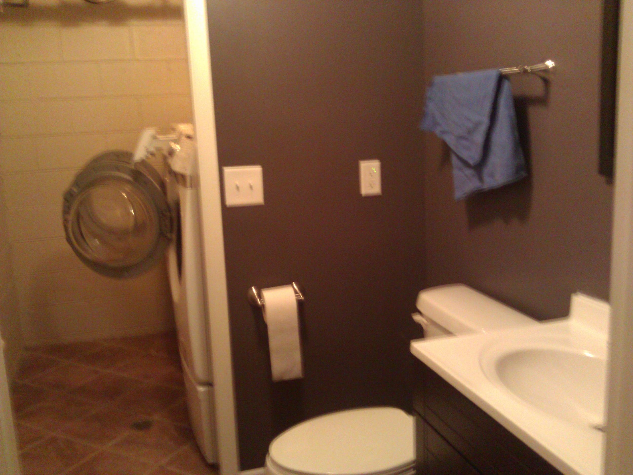 The basement bathroom and laundry room, which are immediately inside the basement garage door.