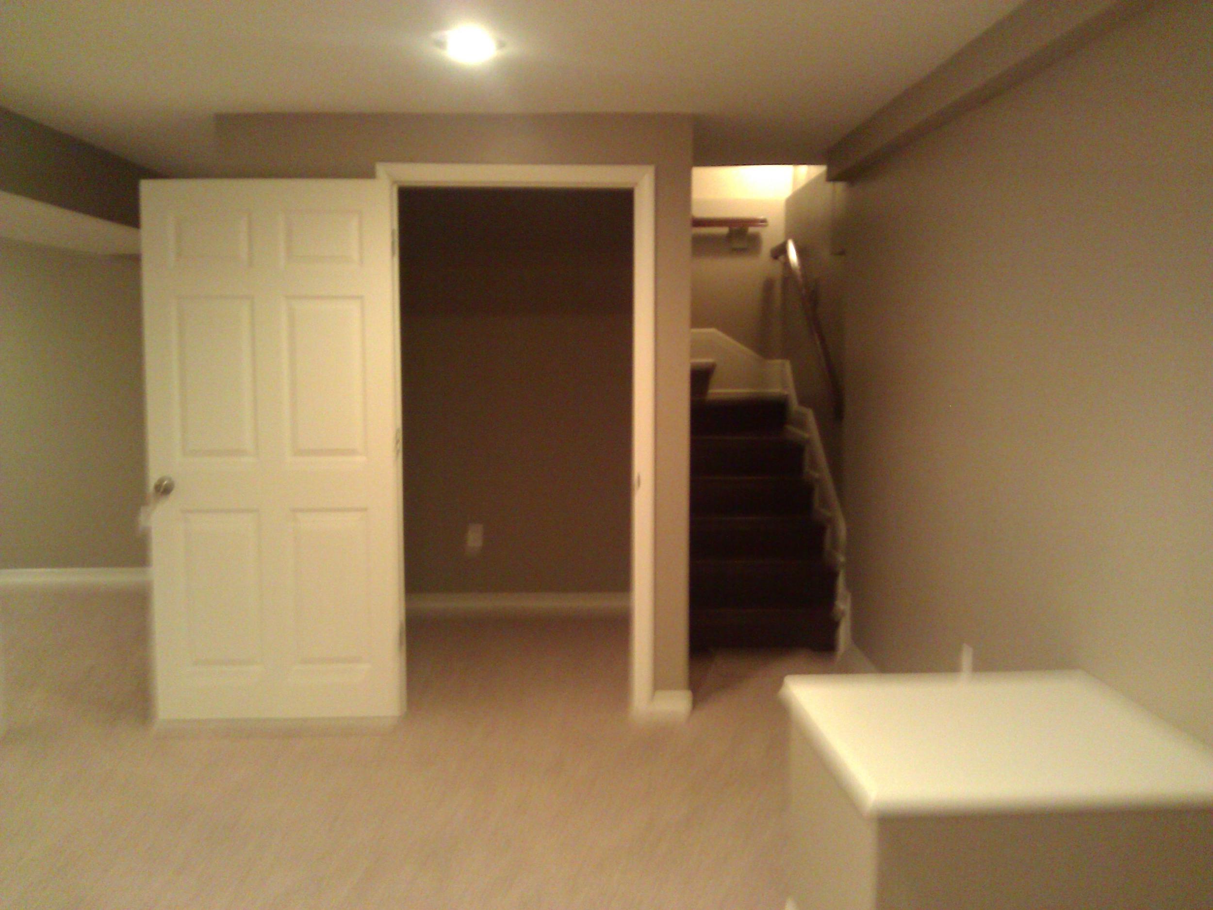 The awesome storage closet and the stairs heading up out of the basement.