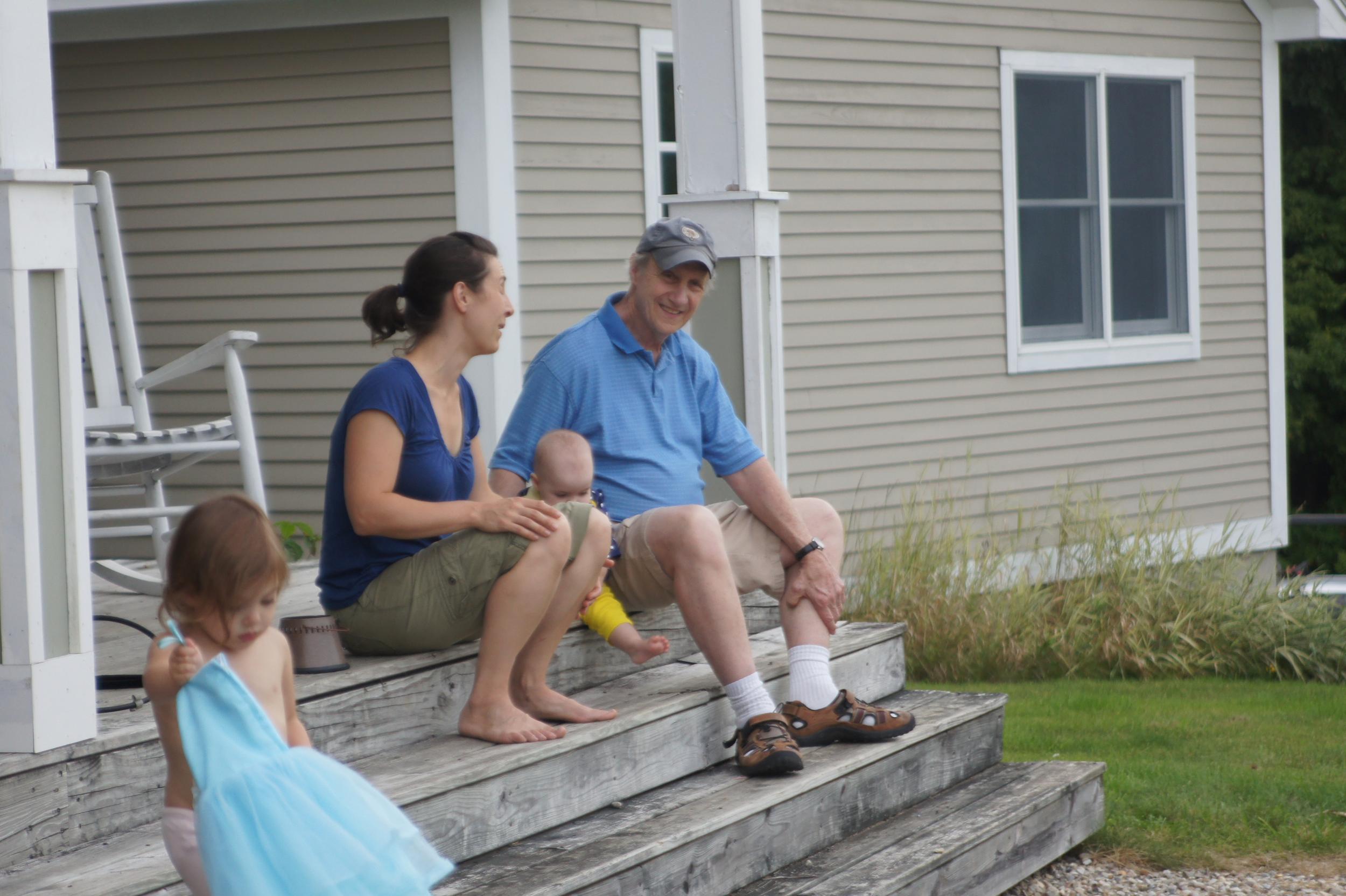 Generations enjoying time together on the porch.