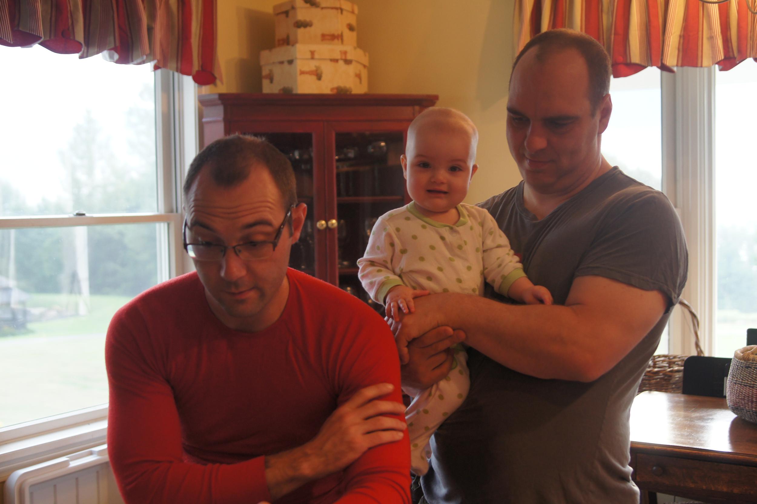 A dad, an uncle, and the cutest spriteling in the house.