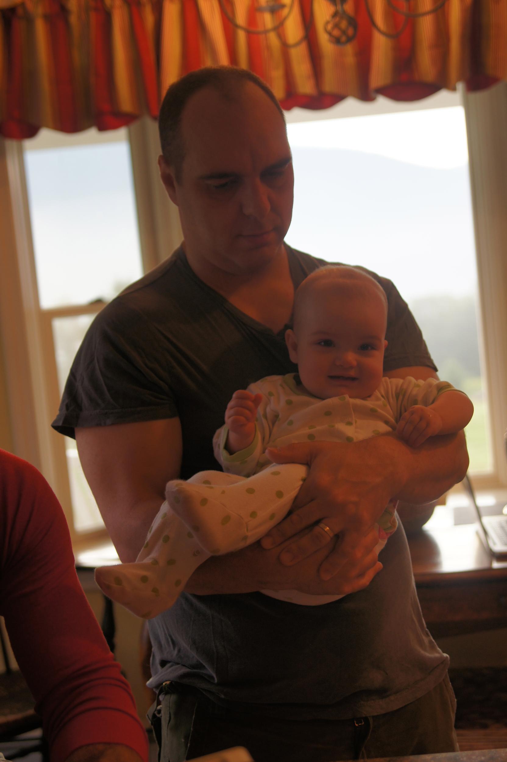 Uncle Chris must look enough like Dad to help her be comfortable.