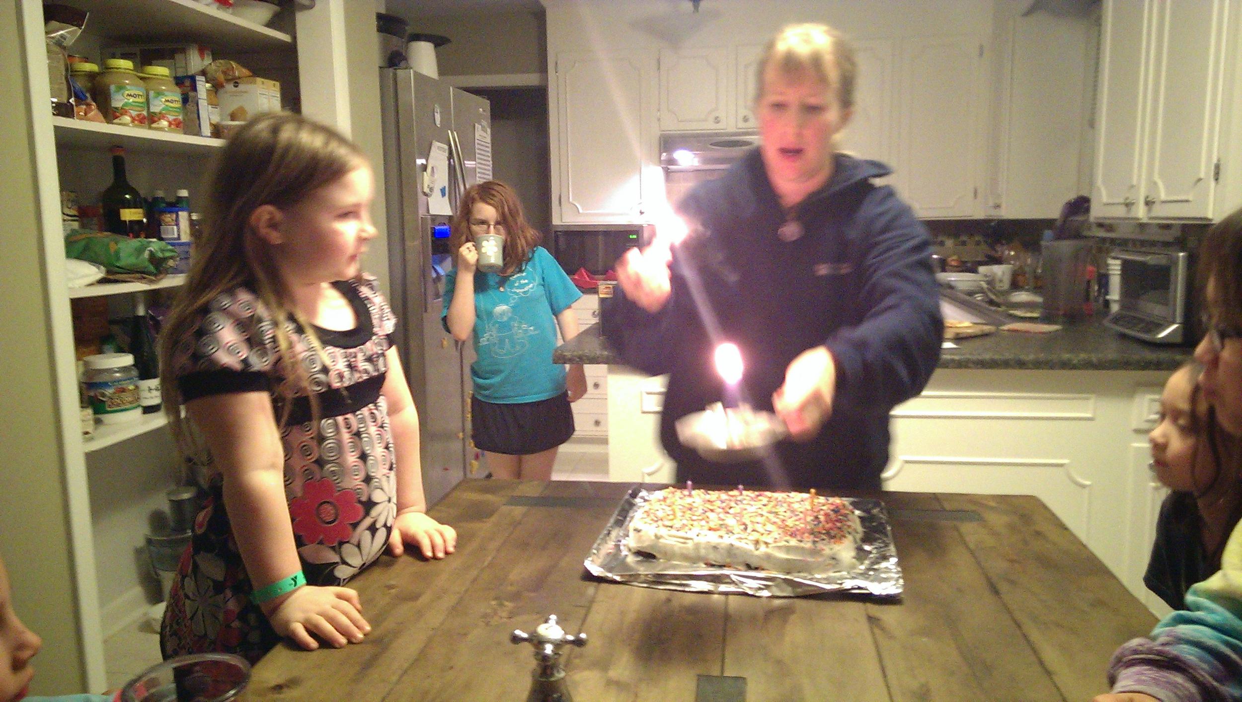 Blowing out one candle...lighting the cake.