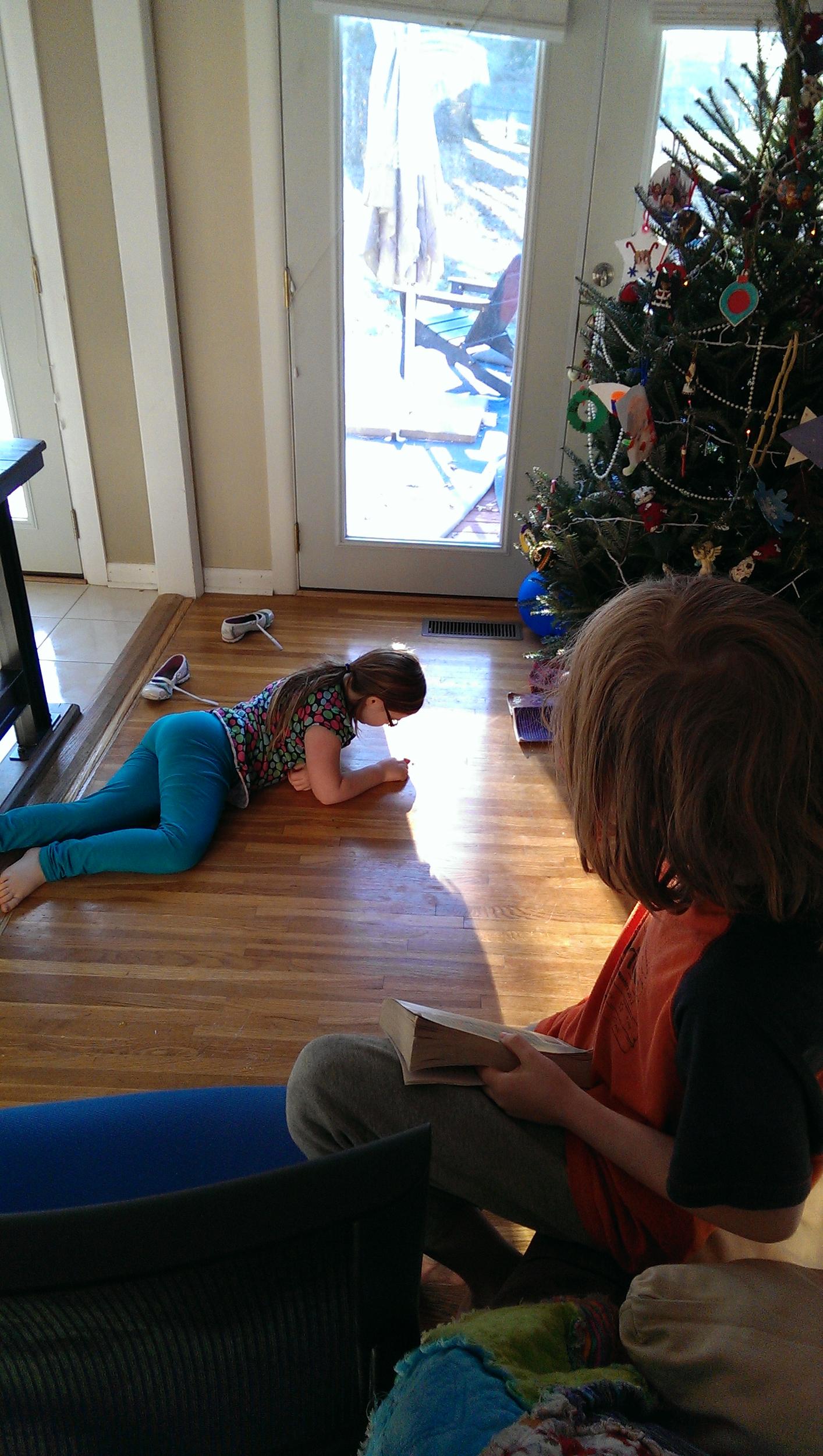 Buster reading to Yessa. He's so excited for her to hear Percy Jackson, too.