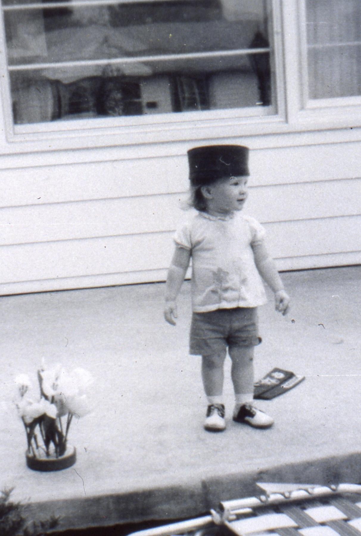 Wearing my brother's Army hat when he was home on leave.