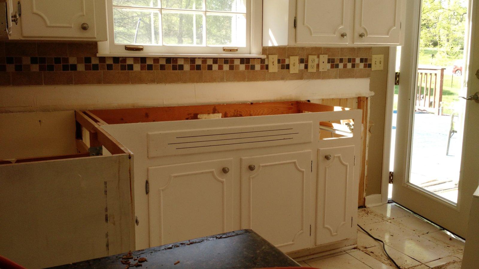 Turns out the cabinets were custom built for the space.