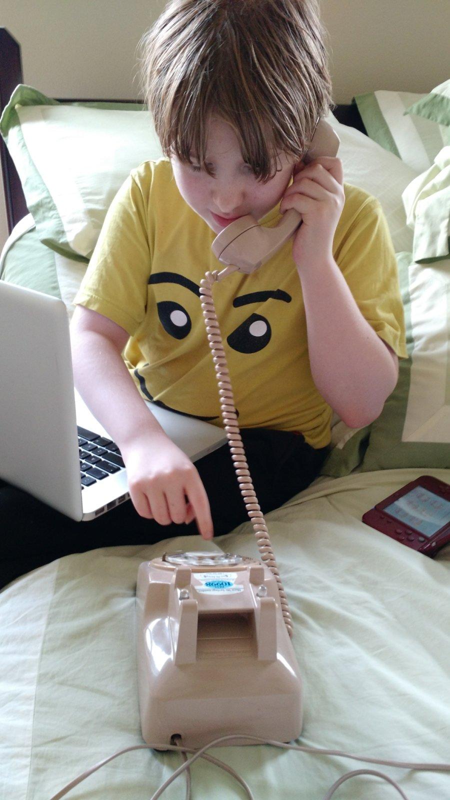 The children indulged me by dialing the rotary phone.