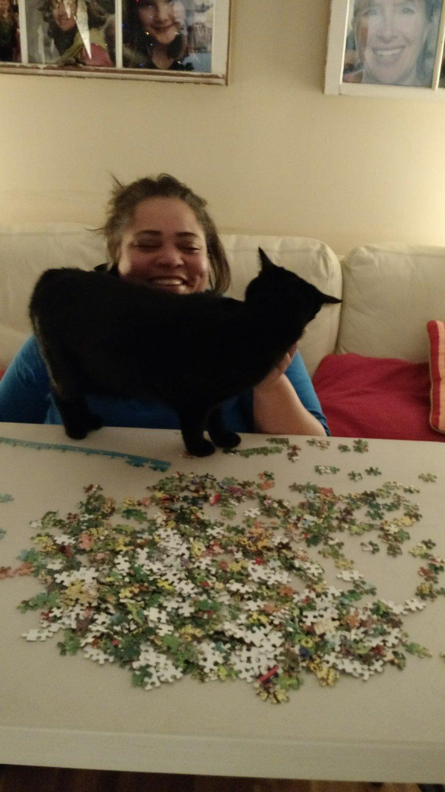 A good puzzle, a good friend, and a friendly cat...cattentment.